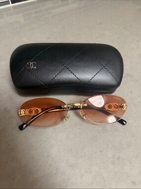 CHANEL Rimless Oval Sunglasses in Brown with Gold Accents